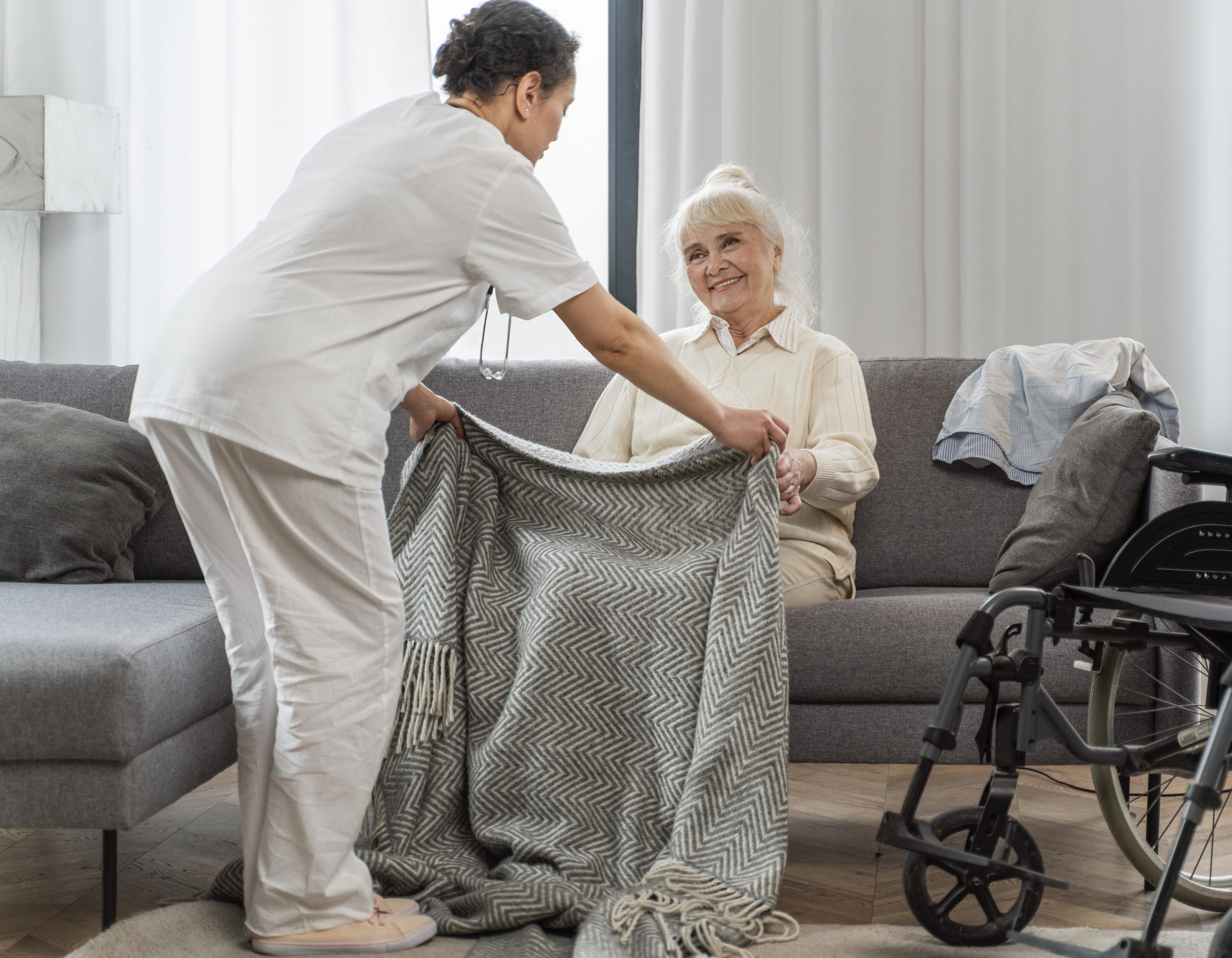 doctor taking care senior woman home
